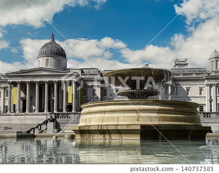 Fountain and National Gallery Facade at Trafalgar Square in London on a Sunny Day 140737385