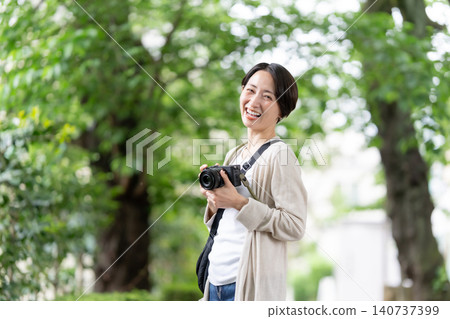 A woman with a camera A woman with a camera 140737399