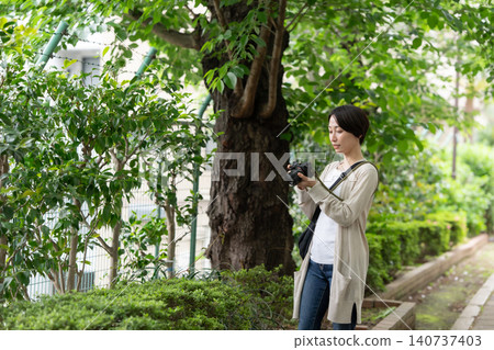 A woman with a camera A woman with a camera 140737403