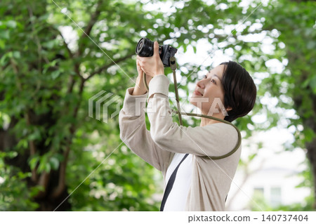 A woman with a camera A woman with a camera 140737404