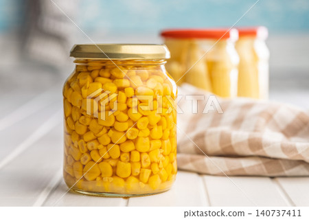 Jar Of Canned Corn Preserves On Kitchen Counter With Pantry Jars And Cloth Jar Of Canned Corn Preserves On Kitchen Counter With Pantry Jars And Cloth 140737411