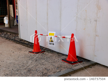 row of orange fluorescent, reflex traffic cones on road. row of orange fluorescent, reflex traffic cones on road. 140737504
