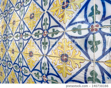 Traditional Portuguese azulejos in vibrant yellow, blue, and green floral patterns provide a classic, decorative Mediterranean aesthetic for design Traditional Portuguese azulejos in vibrant yellow, blue, and green floral patterns provide a classic, decorative Mediterranean aesthetic for design 140738166