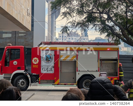 Cordoba, Argentina - June 24, 2026: Fire engine and evacuees during a training fire drill Cordoba, Argentina - June 24, 2026: Fire engine and evacuees during a training fire drill 140738264