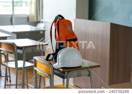 Disaster preparedness supplies placed on a school desk 140738299