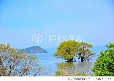 Chikubu Island, floating on Lake Biwa in the fresh greenery of Shiga Prefecture. Chikubu Island, floating on Lake Biwa in the fresh greenery of Shiga Prefecture. 140739033