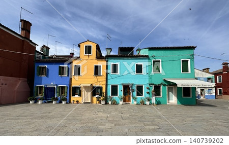 A residential area with brightly colored buildings on Burano Island in Venice, Italy. A residential area with brightly colored buildings on Burano Island in Venice, Italy. 140739202