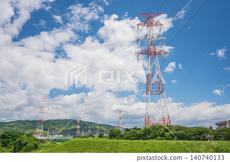 A transmission tower stands on the left bank of the Yodo River in Hirakata City, Osaka Prefecture. A transmission tower stands on the left bank of the Yodo River in Hirakata City, Osaka Prefecture. 140740133