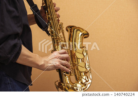 Playing the saxophone (hands) Playing the saxophone (hands) 140740224