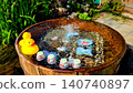 Summer sunshine and a toy duck floating on the water. 140740897