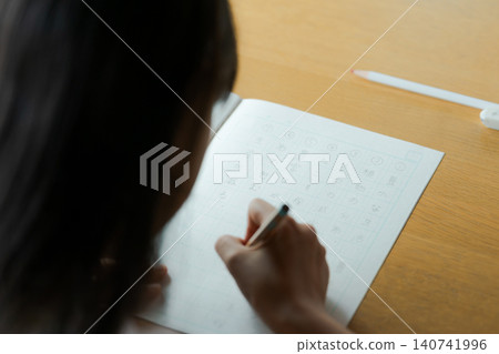 Elementary school students studying kanji Elementary school students studying kanji 140741996