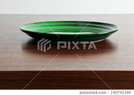 Image of a plate placed on a table Image of a plate placed on a table 140742194