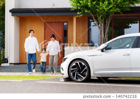 A family of three going out in the car A family of three going out in the car 140742218