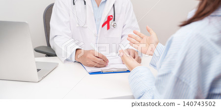 Doctor and patient having a medical consultation for red ribbon concept of December World Aids Day, MADD, October Red ribbon week, February Heart month, Marfan Syndrome, May Stroke awareness Doctor and patient having a medical consultation for red ribbon concept of December World Aids Day, MADD, October Red ribbon week, February Heart month, Marfan Syndrome, May Stroke awareness 140743502
