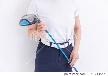 A woman holding a golf driver A woman holding a golf driver 140743544