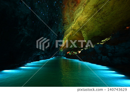 Underwater river illuminated by colored light in Yellow Dragon Cave near Zhangjiajie, China Underwater river illuminated by colored light in Yellow Dragon Cave near Zhangjiajie, China 140743629