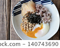 Natto rice with sixteen grains, topped with a soft-boiled egg and pickled young ginger. 140743690