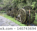 Wooden water wheel system on a stream in Yellow Dragon Park in the mountains near Zhangjiajie, China 140743694