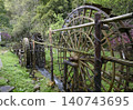 Wooden water wheel system on a stream in Yellow Dragon Park in the mountains near Zhangjiajie, China 140743695
