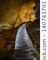 Winding stone staircase in famous huge Yellow Dragon Cave in the mountains near Zhangjiajie, China 140743701