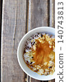 Sixteen-grain rice with raw egg: Mixed grain rice topped with a raw egg mixed with soy sauce. 140743813