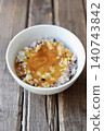 Sixteen-grain rice with raw egg: Mixed grain rice topped with a raw egg mixed with soy sauce. 140743842