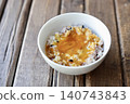 Sixteen-grain rice with raw egg: Mixed grain rice topped with a raw egg mixed with soy sauce. 140743843