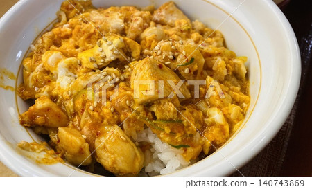 Oyakodon: A rice bowl topped with chicken and egg. Oyakodon: A rice bowl topped with chicken and egg. 140743869