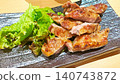 A delicious-looking grilled chicken steak, perfectly cooked to a golden brown. 140743872