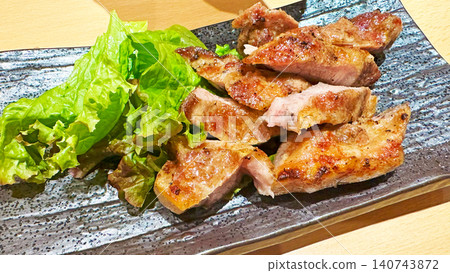 A delicious-looking grilled chicken steak, perfectly cooked to a golden brown. 140743872