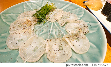 Thinly sliced fresh octopus carpaccio 140743873