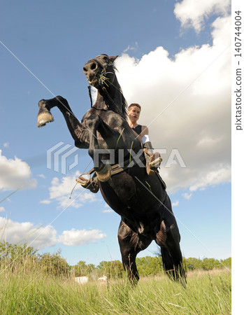 riding man and horse riding man and horse 140744004
