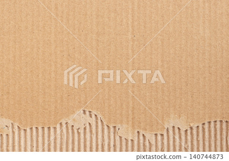Brown cardboard sheet abstract background, texture of recycle paper box in old vintage pattern with ripped edges. Brown cardboard sheet abstract background, texture of recycle paper box in old vintage pattern with ripped edges. 140744873