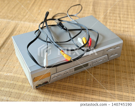 Old VCR and cables - from the left Old VCR and cables - from the left 140745190