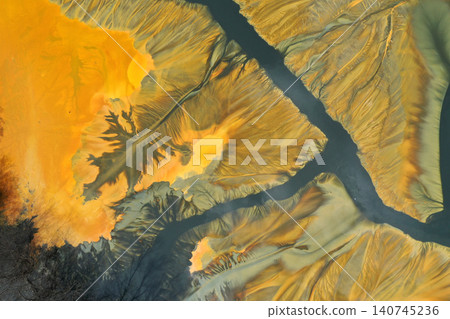 Surreal colorful natural pattern of mining waste waters in decanting lake aerial view 140745236