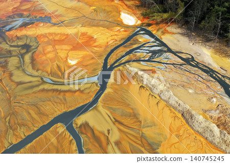 Aerial view of surreal toxic water stream from copper mine in decanting lake. Natural pattern Aerial view of surreal toxic water stream from copper mine in decanting lake. Natural pattern 140745245