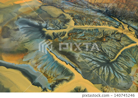 Aerial view of surreal toxic water stream from copper mine in decanting lake. Natural pattern Aerial view of surreal toxic water stream from copper mine in decanting lake. Natural pattern 140745246