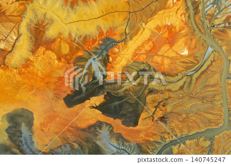 Surreal colorful natural pattern of mining waste waters in decanting lake aerial view Surreal colorful natural pattern of mining waste waters in decanting lake aerial view 140745247