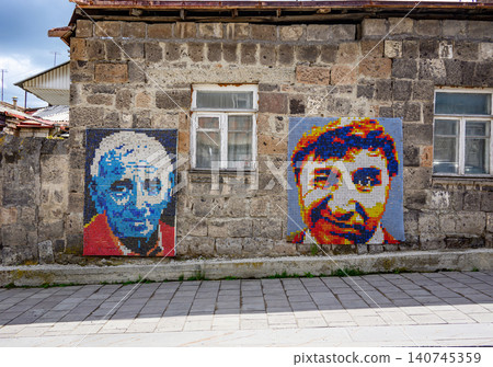 Stone wall with colorful mosaic portraits. Two faces Frunzik Mkrtchyan and Charles Aznavour painted using small tile Stone wall with colorful mosaic portraits. Two faces Frunzik Mkrtchyan and Charles Aznavour painted using small tile 140745359