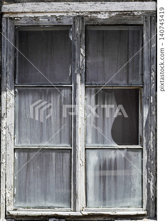 Weathered stone house with single window Weathered stone house with single window 140745419
