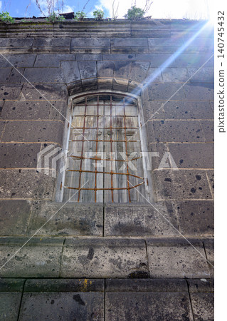 Weathered stone building wall Weathered stone building wall 140745432