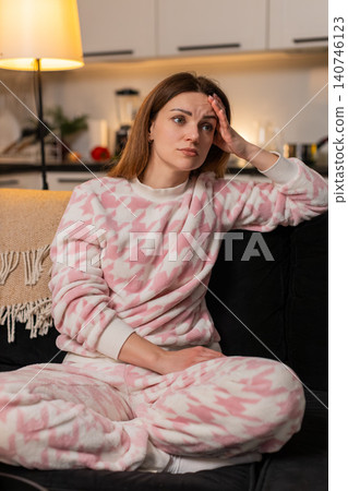 Adult woman depressed anxiety loneliness headache migraine stress at night tired mood unhappy alone Adult woman depressed anxiety loneliness headache migraine stress at night tired mood unhappy alone 140746123