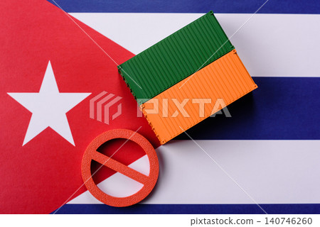 The cargo container ban on the Cuba flag as a conceptual backdrop. The cargo container embargo The cargo container ban on the Cuba flag as a conceptual backdrop. The cargo container embargo 140746260