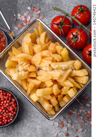Golden French fries fried with salt and spices, unhealthy takeaway food. French fries Golden French fries fried with salt and spices, unhealthy takeaway food. French fries 140746423