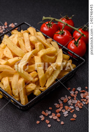 Golden French fries fried with salt and spices, unhealthy takeaway food. French fries 140746445