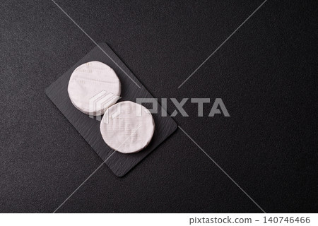 Brie or Camembert cheese is a white, round shape for baking and melting. Camembert cheese Brie or Camembert cheese is a white, round shape for baking and melting. Camembert cheese 140746466