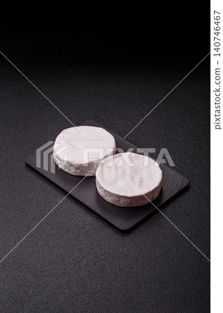 Brie or Camembert cheese is a white, round shape for baking and melting. Camembert cheese Brie or Camembert cheese is a white, round shape for baking and melting. Camembert cheese 140746467
