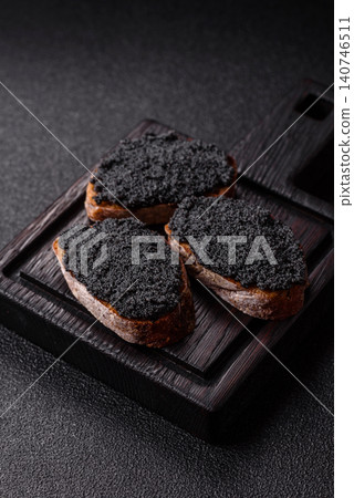 Black caviar from beluga or sturgeon, an expensive delicacy for sandwiches. Black caviar 140746511