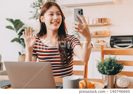 Asian woman using computer remote for business studying, watching online virtual webinar training meeting, video call. asian business woman talking on laptop in home office. Banner, copy space Asian woman using computer remote for business studying, watching online virtual webinar training meeting, video call. asian business woman talking on laptop in home office. Banner, copy space 140746660