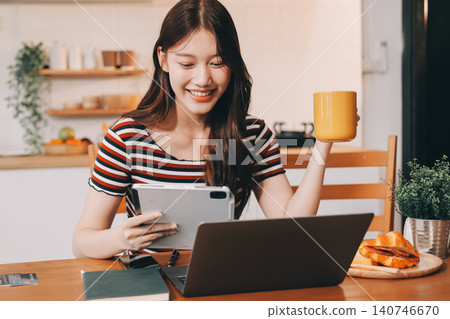 Asian woman using computer remote for business studying, watching online virtual webinar training meeting, video call. asian business woman talking on laptop in home office. Banner, copy space 140746670